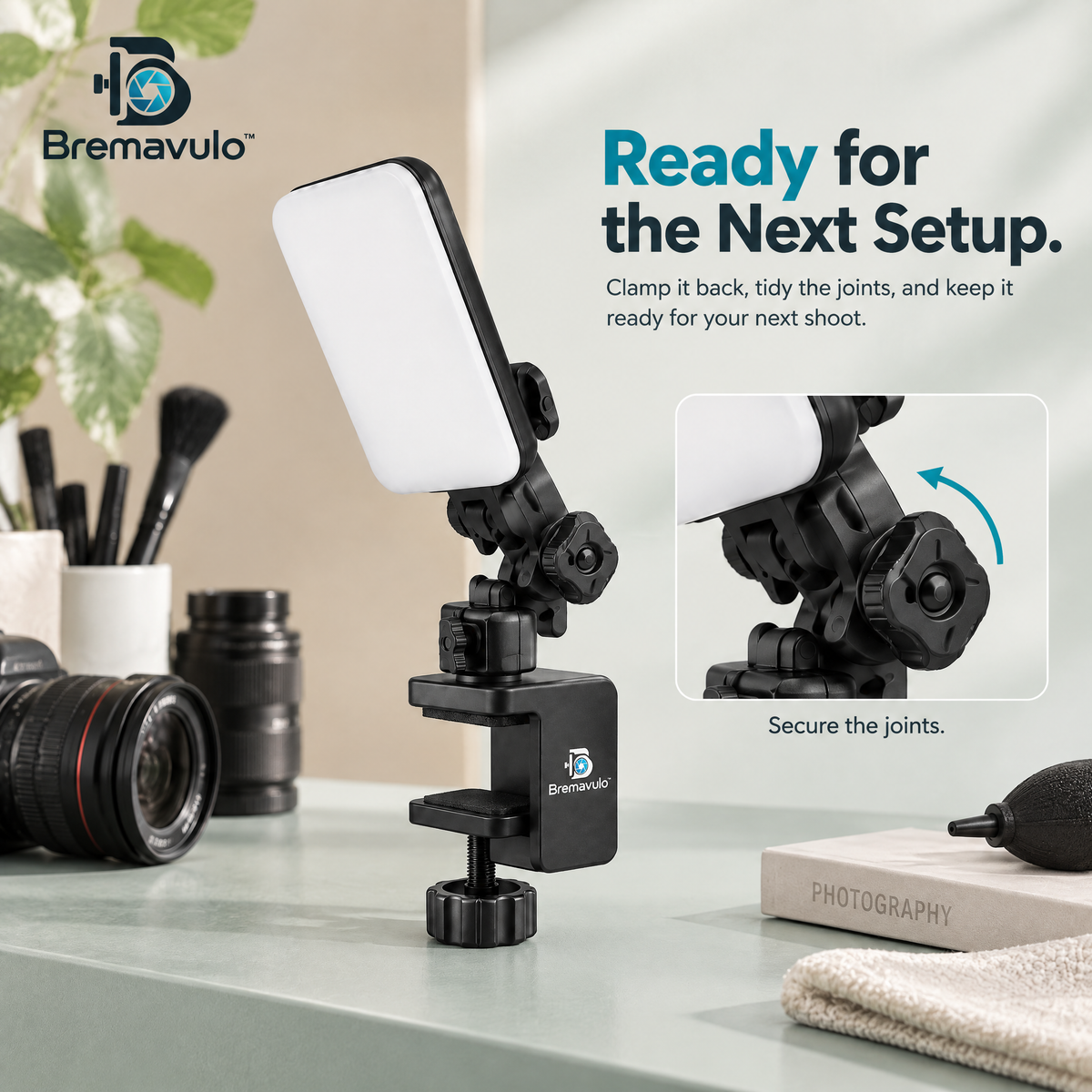 Bremavulo LightDock adjustable joint holding a compact light panel above a tabletop